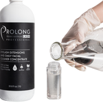 a gloved hand pouring distilled water into a foaming pump bottle with prolong lash concentrate 1 litre