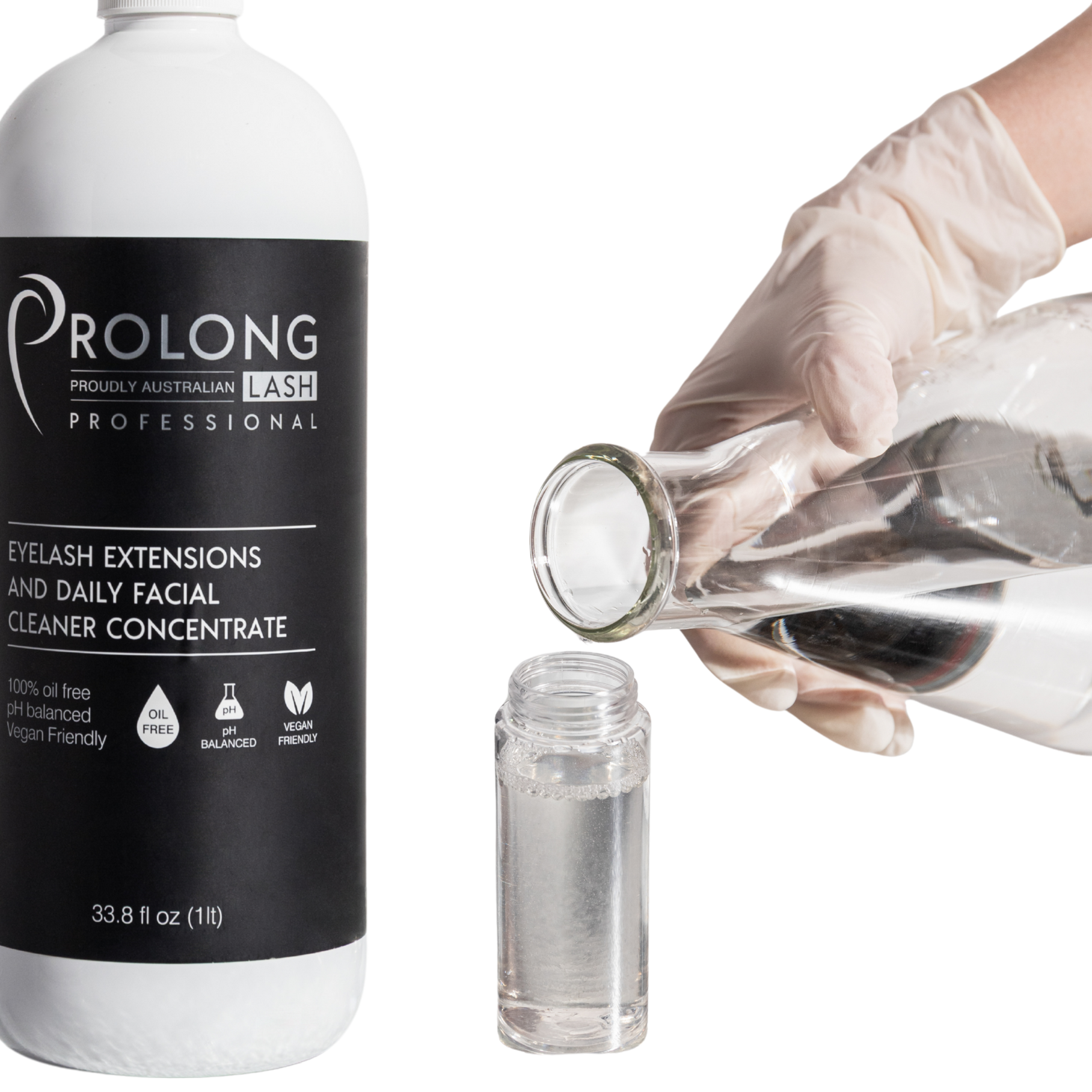a gloved hand pouring distilled water into a foaming pump bottle with prolong lash concentrate 1 litre
